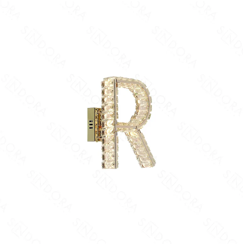 Arandela LETRA R Ø20x28CM 10W 3000K 1000LM BIVOLT METAL DOURADO+CRISTAL TRANSPARENTE CX MASTER: 69x36x52CM 19,2KG (10 UN. ) | CX: 34x25x13CM 1,7KG PESO UN.:1,9KG Sindora DCB02936